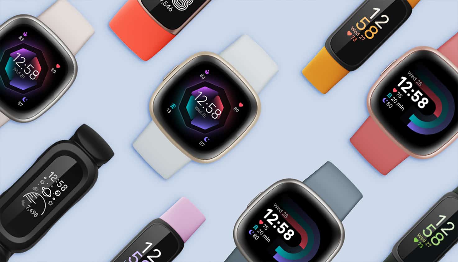 verschillende modellen fitbit smartwatches op een blauwe achtergrond