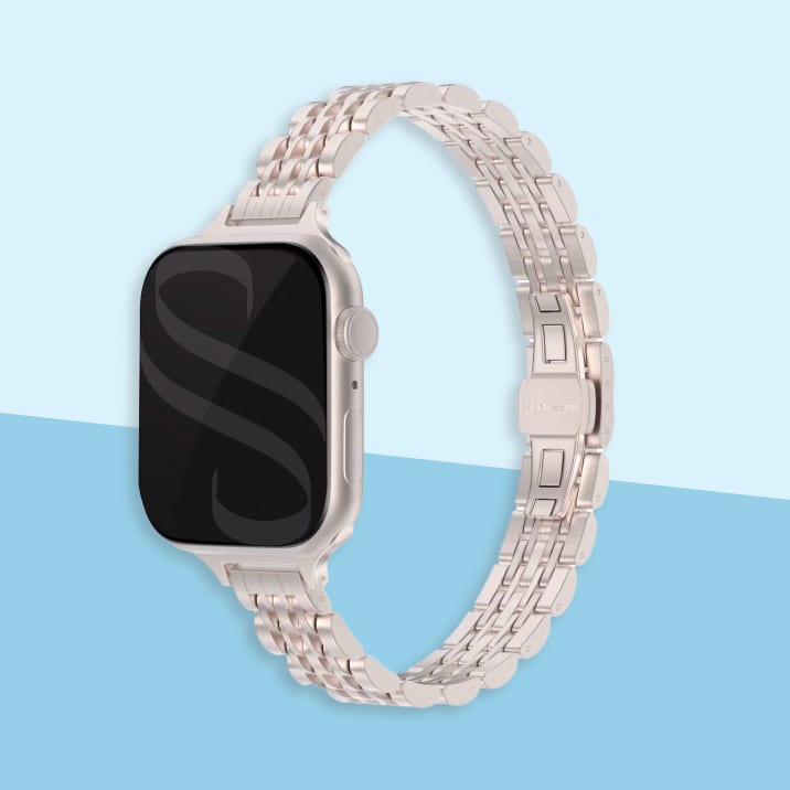 Sterrenlicht kleurig Slim Steel Jubilee Inspired schakelbandje met een Apple Watch in de kleur sterrenlicht.